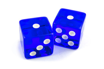 Two blue glass game dice in close-up isolated on white background. One and one with a shadow.