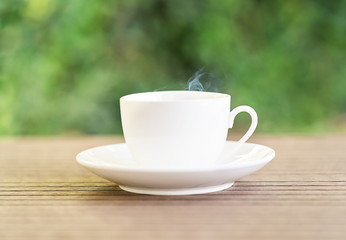 White ceramic coffee cup on table