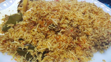 A close up  view of cooked rice chicken biryani made with traditional recipe