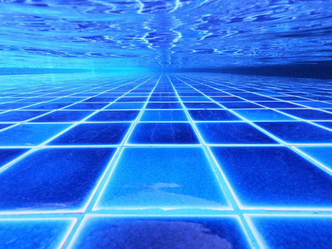 The underwater image of the blue swimming pool