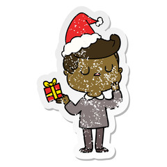 distressed sticker cartoon of a man wondering wearing santa hat