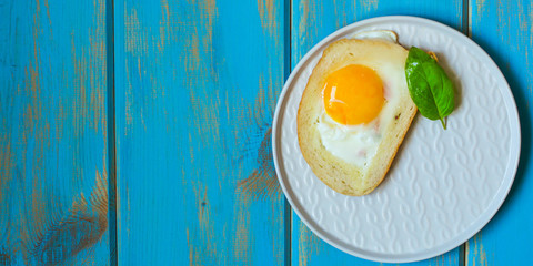 fried eggs in bread, scrambled eggs (yolk and white) sandwich. food background. top