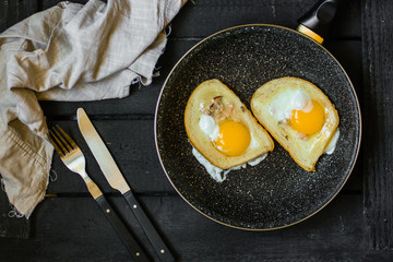 fried eggs in bread, scrambled eggs (yolk and white) sandwich. food background. top