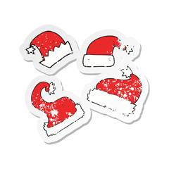 retro distressed sticker of a cartoon christmas hats