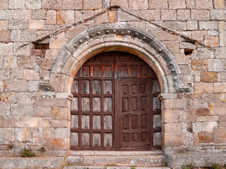 Fototapeta na wymiar Main door of a church in a village of Castilla y Leon in Spain