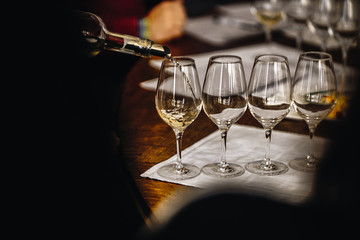A Glass of White Wine at a Table Tasting