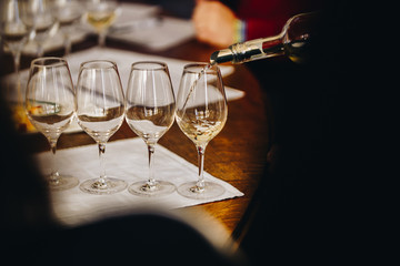 A Glass of White Wine at a Table Tasting