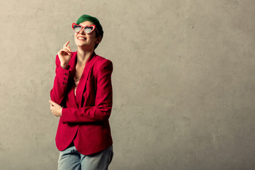Positive cheerful woman wearing a red jacket