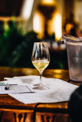 A Glass of White Wine at a Table Tasting