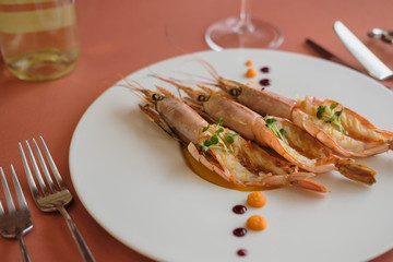 Langoustines, Nephrops norvegicus, Dublin Bay Prawn or Norway Lobsters.  Langoustine, Langostino or Scampi on plate. Seafood, shelfish. Gourmet restaurant seafood dish