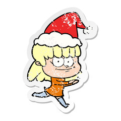 distressed sticker cartoon of a smiling woman wearing santa hat