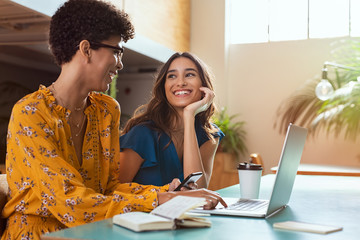 Student friends studying on laptop