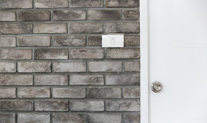 old brick wall background with lamp switch