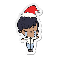 sticker cartoon of a woman crying wearing santa hat