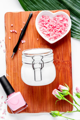 salt and cream for nail care in spa top view