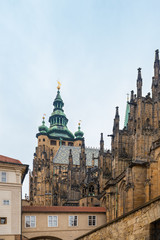Fototapeta na wymiar Prague, Czech Republic. Gothic style rooftop decorations of St. Vitus Cathedral, part of the Prague Castle complex.