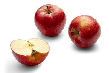 Naklejka na ściany i meble Three red apples on a white background