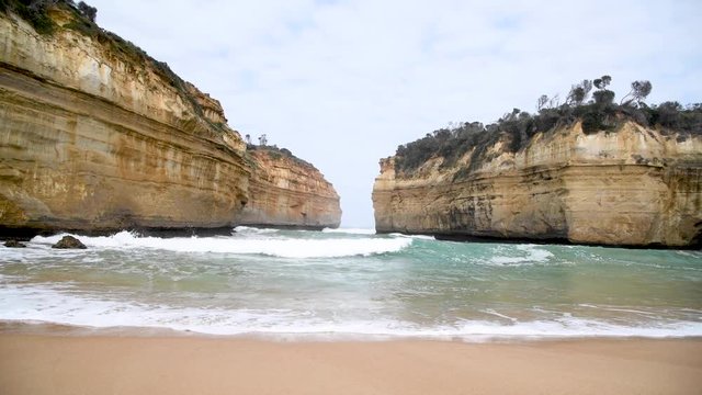 Loch Ard Gorge Beach and tall cliffs above the ocean, Australia