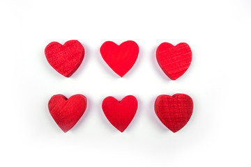 Small red wooden hearts isolated on the white background.