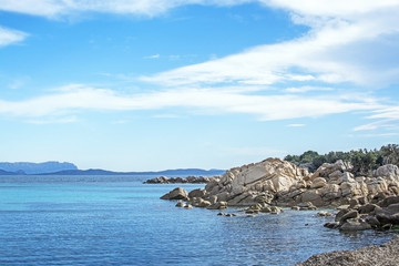 Green water and granite rock archipelago landscape on a beach inSardinia