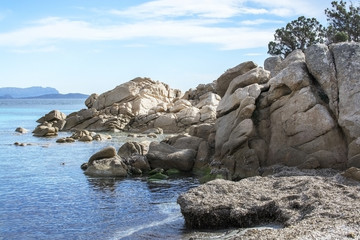 Green water and granite rock archipelago landscape on a beach inSardinia