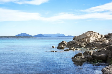 Green water and granite rock archipelago landscape on a beach inSardinia
