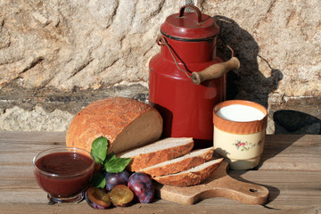 Home made plum jam, your own baking round loaf of bread and fresh milk. A healthy, simple and tasty...