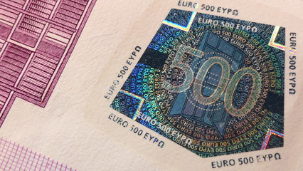 Close-up view of the number 500 in a security seal of a 500 Euro banknote