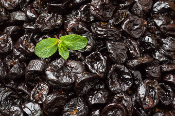 Background of delicious dried plums. Texture of food. Close up