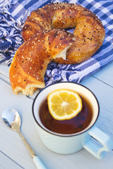 Turkish bagels with tea of ​​cup on wooden blue background.
