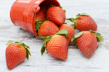 Strawberries lying on wood