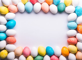 Eggs flat lay on a white background. Easter and spring composition. Copy space.