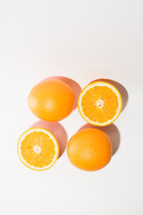 Orange halves on white background