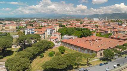 Fototapeta na wymiar Aerial view of Pisa from the sky. Tuscany cityscape on a sunny day