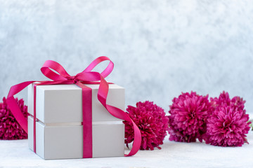 gift box with ribbon and flowers