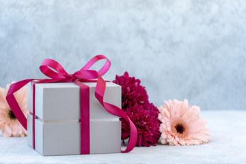 gift box with ribbon and flowers