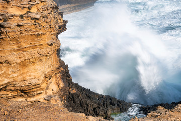 Fury of the waves crushing against the rocks. Ocean storm