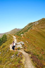 Fototapeta na wymiar Woman hiking on Mountain 