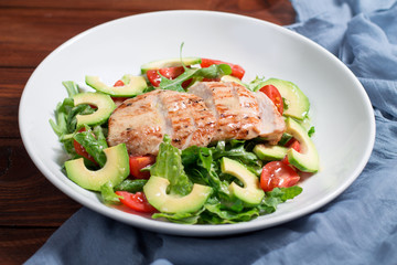 Mix salad with grilled chicken, avocado, tomatoes