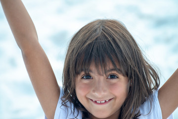 Happy young girl smiling with open arms