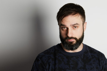 Obraz premium Cute bearded young man on white background
