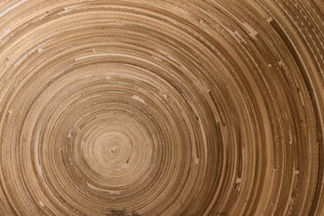 Texture of wooden bowl seen from top down.