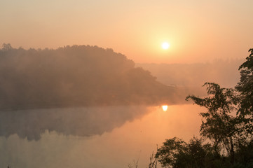 beautiful pink sunruse under river. India landscape