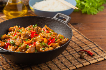 Chicken kung pao. Fried chicken pieces with peanuts and peppers.