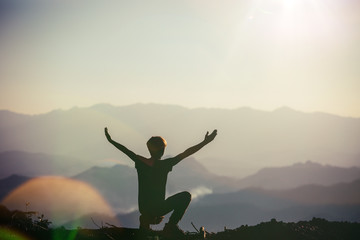 Silhouette illustration of a man praying outside at beautiful landscape