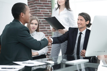 Business Partner Shake Hands on meetinig in modern office building