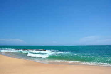 Fototapeta na wymiar Ocean waves with white caps breaking on the shore. Indian Ocean, Sri Lanka