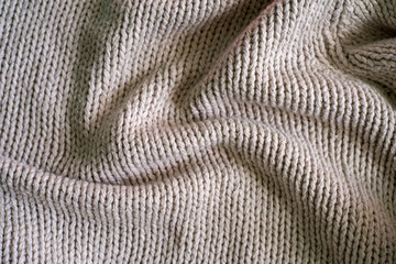 Beige knitting wool texture background