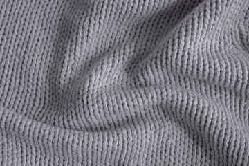 Fototapeta na wymiar Grey knitting wool texture background