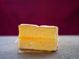 piece of cheese on wooden board